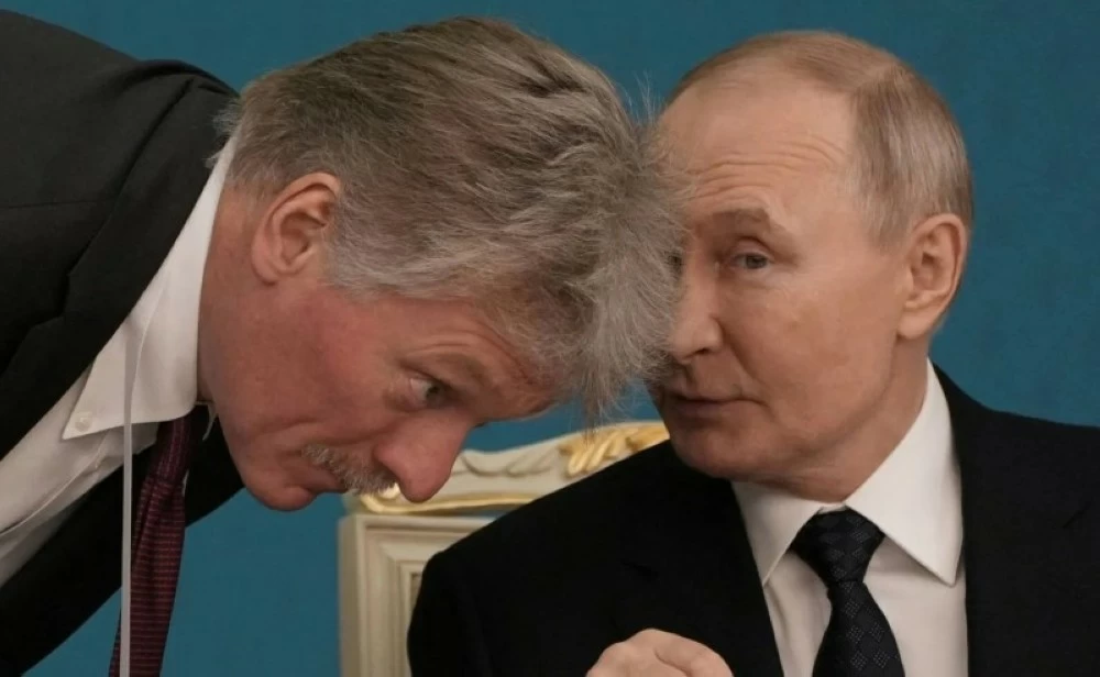 بوتين وبيسكوف.