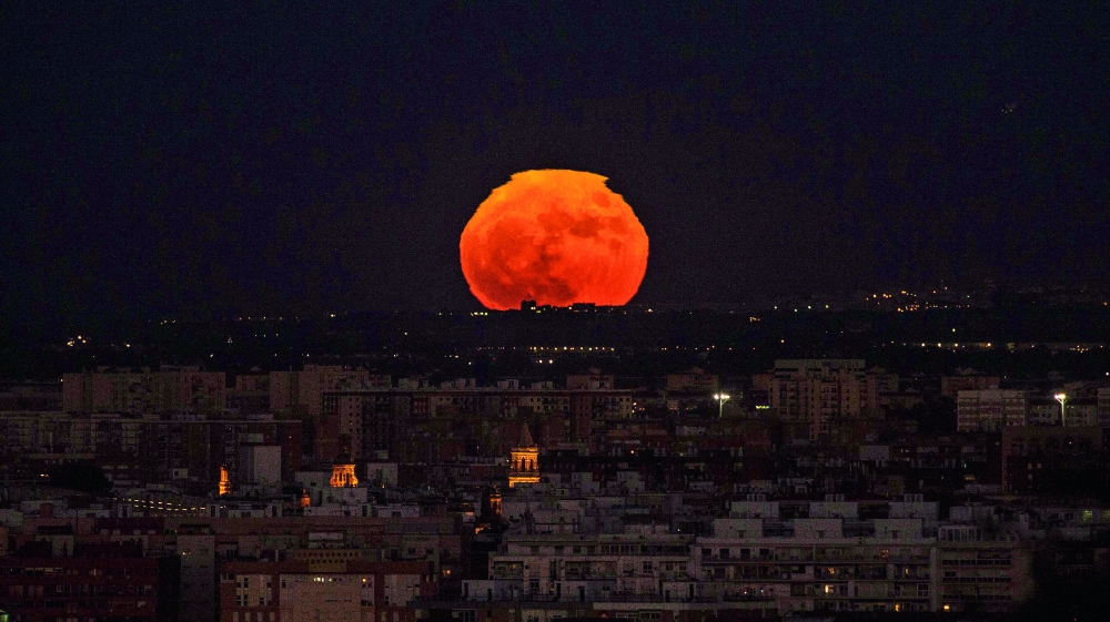 TOPSHOT - A supermoon rises over Sevilla on November 14, 2016. The phenomenon happens when the moon is full at the same time as, or very near, perigee -- its closest point to Earth on an elliptical, monthly orbit. It was the closest to Earth since 1948 at a distance of 356,509 kilometres (221,524 miles), creating what NASA described as 