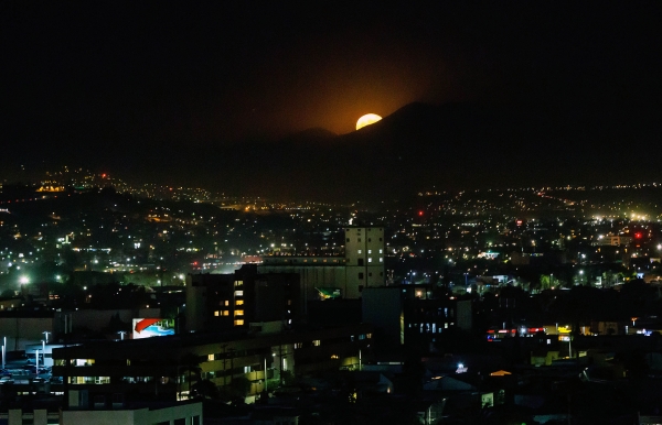 The 'Supermoon' is seen over Tijuana, Baja California State, Mexico on November 14, 2016.   Skygazers headed to high-rise buildings, ancient forts and beaches on November 14 to witness the closest 