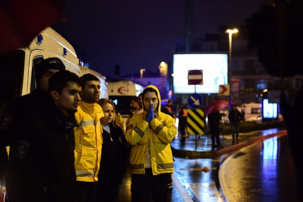 TOPSHOT - A first aid officer reacts at the site of an armed attack January 1, 2017 in Istanbul. At least two people were killed in an armed attack Saturday on an Istanbul nightclub where people were celebrating the New Year, Turkish television reports said. / AFP / YASIN AKGUL
