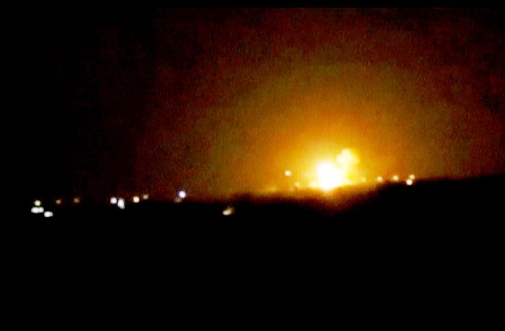 A still image taken from a video posted to a social media website and said to be shot on April 27, 2017, shows explosions and rising flames amid lights in distance, said to be shot in Damascus, Syria. Social Media Website via Reuters TV ATTENTION EDITORS - THIS IMAGE HAS BEEN SUPPLIED BY A THIRD PARTY. IT HAS BEEN CHECKED BY REUTERS' SOCIAL MEDIA TEAM AND REVIEWED BY A SENIOR EDITOR. REUTERS IS CONFIDENT THE EVENTS PORTRAYED ARE GENUINE
