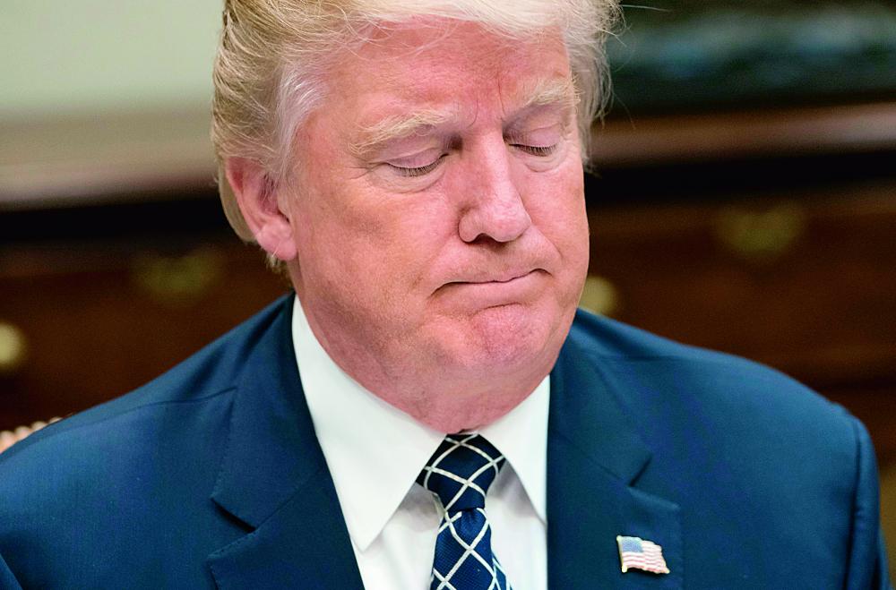 US President Donald Trump speaks about the Senate health care bill during a lunch with members of the US military in the Roosevelt Room of the White House in Washington, DC, July 18, 2017. Trump railed Tuesday against dissenters in his party who dashed his months-long effort to dismantle Barack Obama's landmark health care law.  / AFP / SAUL LOEB
