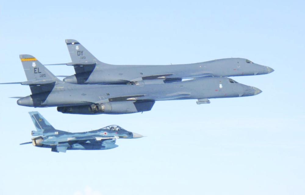 In this photo released by Japan Air Self Defense Force, U.S. Air Force B-1B bombers, top, fly with a Japan Air Self Defense Force F-2 fighter jet over Japan's southern island of Kyushu, just south of the Korean Peninsula, during a Japan-U.S. joint exercise Sunday, July 30, 2017. Japan's Defense Ministry reported the U.S. supersonic bombers flown from the Anderson Air Force Base in Guam conducted a joint exercise with South Korean Air Force over the Korean Peninsula later in the day. The U.S. Pacific Air Forces said in a statement that the mission was a response to consecutive intercontinental ballistic missile tests by North Korea this month. (Japan Air Self Defense Force via AP)