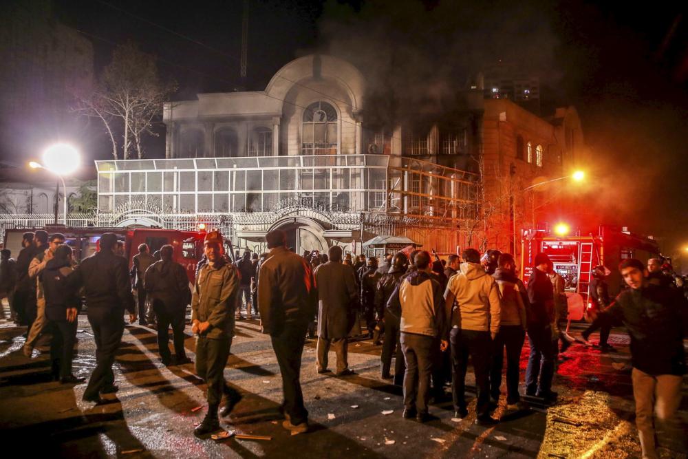 جانب من الاعتداءات على سفارة المملكة في طهران وقنصليتها في مشهد (أرشيفية).