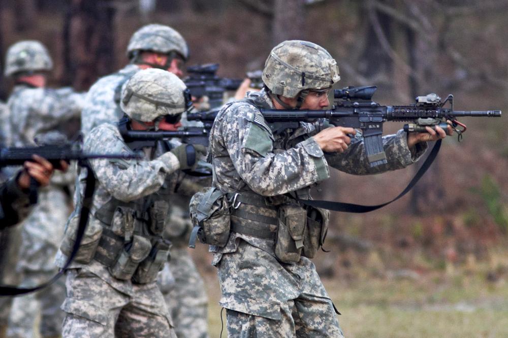 Scouts with the 82nd Airborne Division’s 1st Brigade Combat Team fire on a line during a course in advanced rifle marksmanship March 21-24, 2011, at Fort Bragg, N.C.  The weeklong course emphasized adapting to battlefield problems by knowing one’s tools and capabilities.  (U.S. Army photo by Sgt. Michael J. MacLeod)