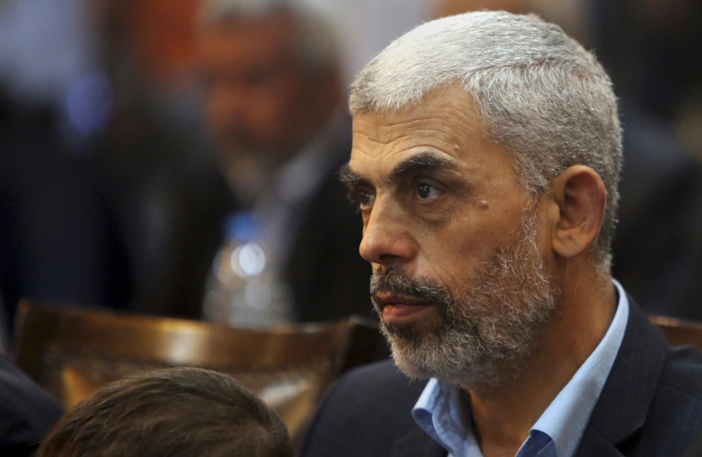 FILE - In this May 1, 2017 file photo, Yehiyeh Sinwar, a top Hamas official in Gaza attends a news conference in Gaza City. On Monday, Aug. 28, 2017, Sinwar, Hamas’ new leader in the Gaza Strip, said his group has restored relations with Iran after a five-year rift and is using its newfound financial and military aid to gear up for a new round of battle with Israel. (AP Photo/Adel Hana, File)