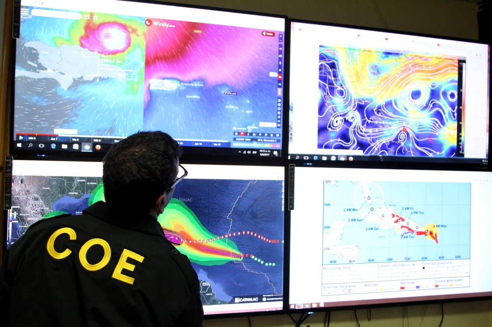 A member of the Emergency Operations Committee (COE) monitors the trajectory of Hurricane Irma in Santo Domingo, Dominican Republic, September 6, 2017.  REUTERS/Ricardo Rojas