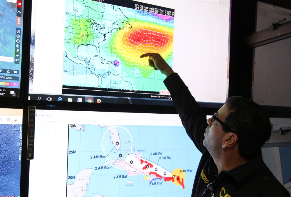 A member of the Emergency Operations Committee (COE) monitors the trajectory of Hurricane Irma in Santo Domingo, Dominican Republic, September 6, 2017.  REUTERS/Ricardo Rojas