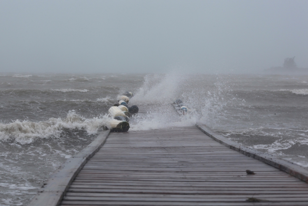 Waves break over a dock as Hurricane Irma slammed across islands in the northern Caribbean on Wednesday, in Fajardo, Puerto Rico September 6, 2017.  REUTERS/Alvin Baez