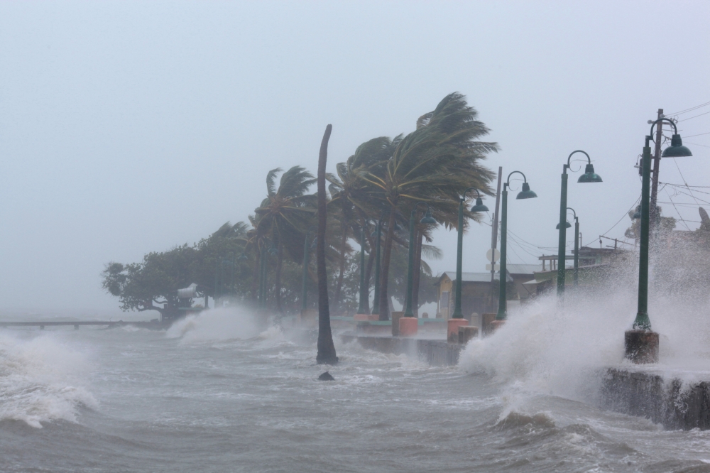 Waves crash against the seawall as Hurricane Irma slammed across islands in the northern Caribbean on Wednesday, in Fajardo, Puerto Rico September 6, 2017.  REUTERS/Alvin Baez