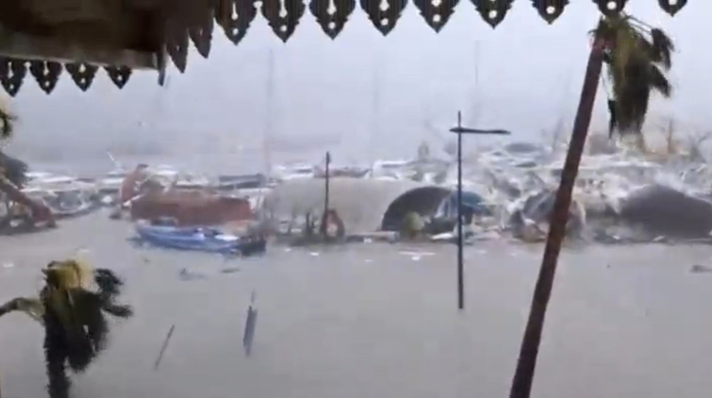 General view of half-submerged vehicles, boats and debris in the flooded harbour as Hurricane Irma  hits the French island territory of Saint Martin September 6, 2017, in this video grab made from footage taken from social media.  Mandatory credit RCI GUADELOUPE/Handout via REUTERS   ATTENTION EDITORS - THIS IMAGE HAS BEEN SUPPLIED BY A THIRD PARTY. NO RESALES. NO ARCHIVE. REUTERS IS UNABLE TO INDEPENDENTLY VERIFY THE AUTHENTICITY, CONTENT, LOCATION OR DATE OF THIS IMAGE.