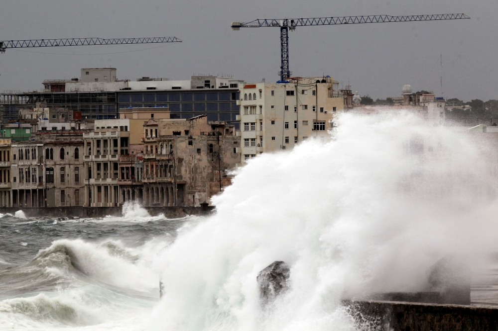 FILE PHOTO: Waves crash against the seafront boulevard El Malecon ahead of the passing of Hurricane Irma, in Havana, Cuba September 9, 2017. REUTERS/Stringer  NO SALES. NO ARCHIVES/File Photo