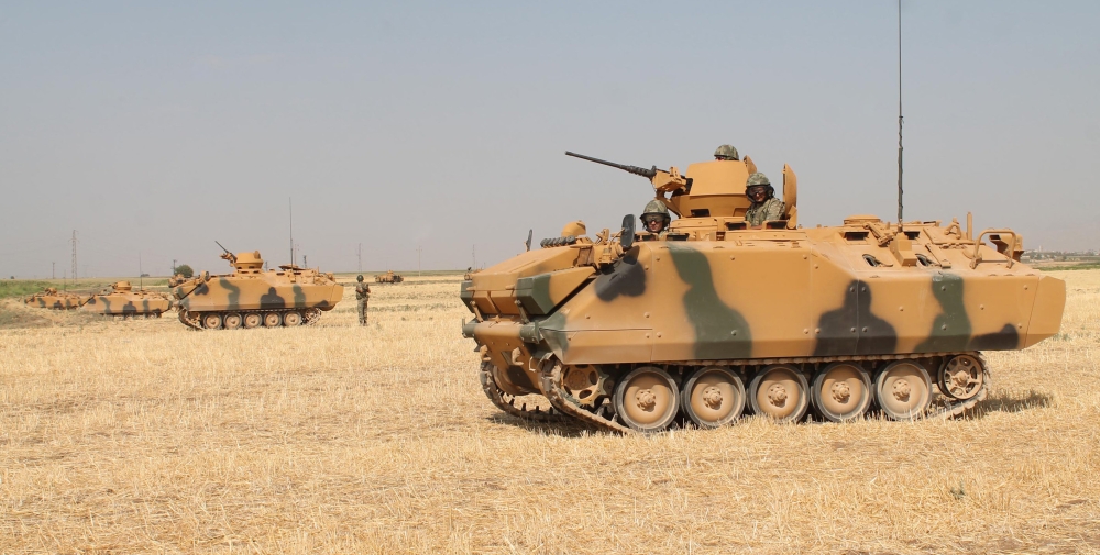 Turkish soldiers on armoured personnel carriers (APC) are seen during a military exercise near the Turkish-Iraqi border in Silopi, Turkey, September 18, 2017. Mehmet Selim Yalcin/Dogan News Agency, DHA via REUTERS ATTENTION EDITORS - THIS PICTURE WAS PROVIDED BY A THIRD PARTY. NO RESALES. NO ARCHIVE. TURKEY OUT. NO COMMERCIAL OR EDITORIAL SALES IN TURKEY.