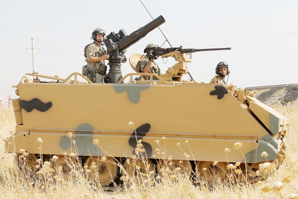 Turkish soldiers on an armoured personnel carrier (APC) are seen during a military exercise near the Turkish-Iraqi border in Silopi, Turkey September 18, 2017. Mehmet Selim Yalcin/Dogan News Agency, DHA via REUTERS ATTENTION EDITORS - THIS PICTURE WAS PROVIDED BY A THIRD PARTY. NO RESALES. NO ARCHIVE. TURKEY OUT. NO COMMERCIAL OR EDITORIAL SALES IN TURKEY.