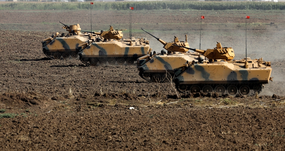 Turkish armoured personnel carriers (APC) maneuver during a military exercise near the Turkish-Iraqi border in Silopi, Turkey September 23, 2017. REUTERS/Umit Bektas