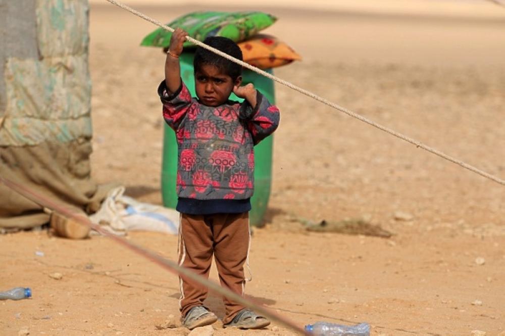 طفل عراقي لاجئ
