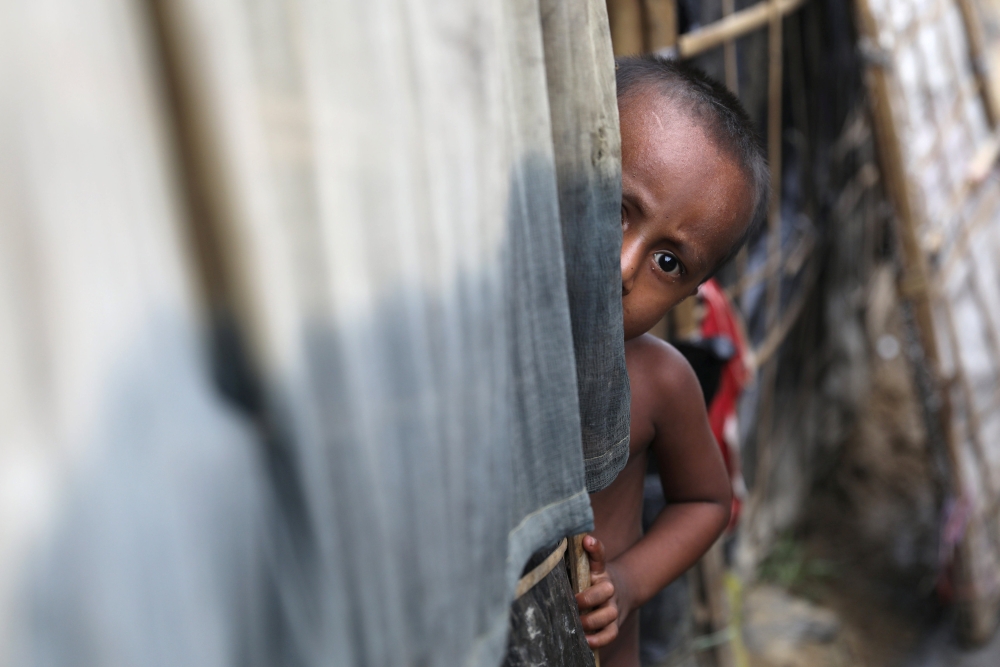 A Rohingya refugee child looks on in the Palong Khali refugee camp in Cox's Bazar, Bangladesh, November 16, 2017. REUTERS/Mohammad Ponir Hossain