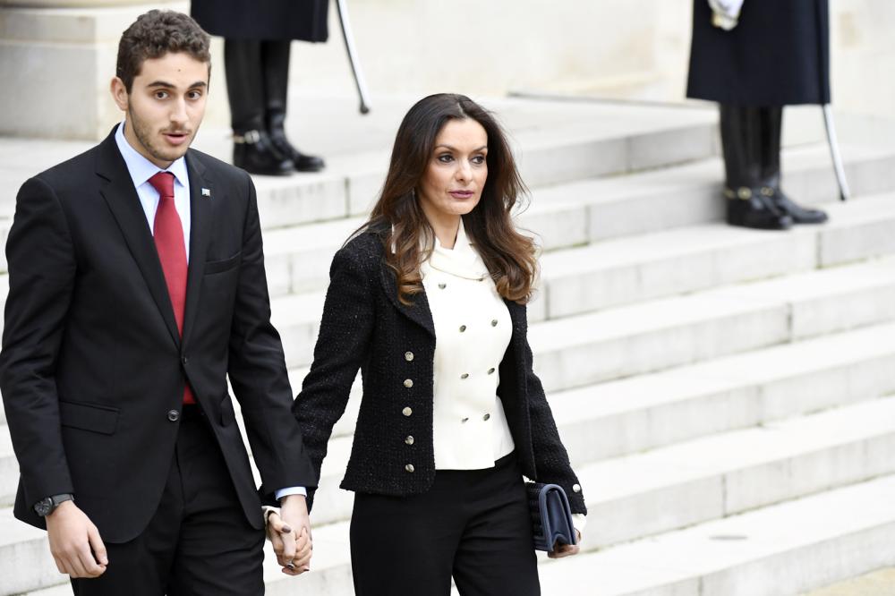 Lara Bachir El-Alzm, (R), wife of Lebanese Prime Minister, and her son  Houssam leave after meeting with French President at the Elysee Presidential Palace on November 18, 2017 in Paris. Saad Hariri arrived in France on November 18 from Saudi Arabia, where his shock resignation announcement two weeks ago sparked accusations that he was being held there against his will. / AFP / BERTRAND GUAY
