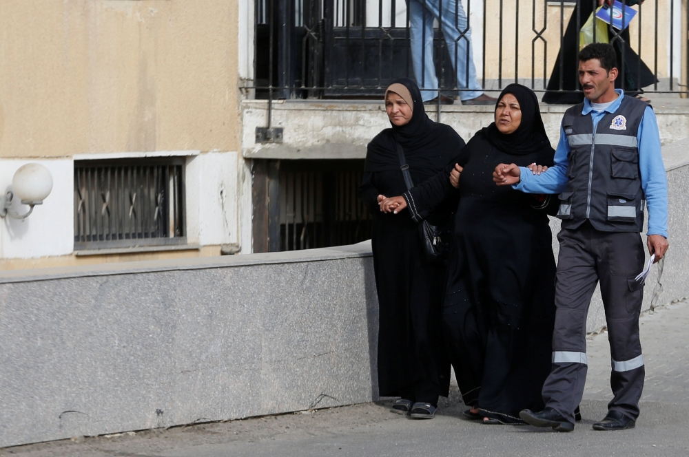 Relatives of victims of the Al Rawdah mosque attack, are seen leaving the Suez Canal University hospital in Ismailia, Egypt November 25, 2017. REUTERS/Amr Abdallah Dalsh