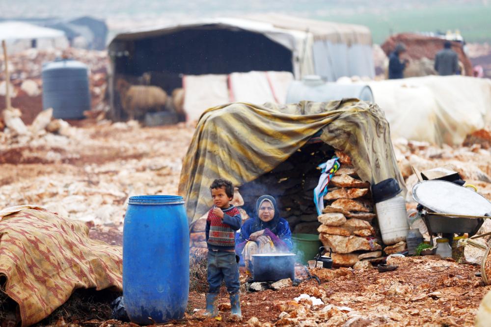 Displaced Syrians are pictured at Kelbit refugee camp, near the Syrian-Turkish border, in Idlib province, Syria January 17, 2018. Picture taken January 17, 2018. REUTERS/Osman Orsal