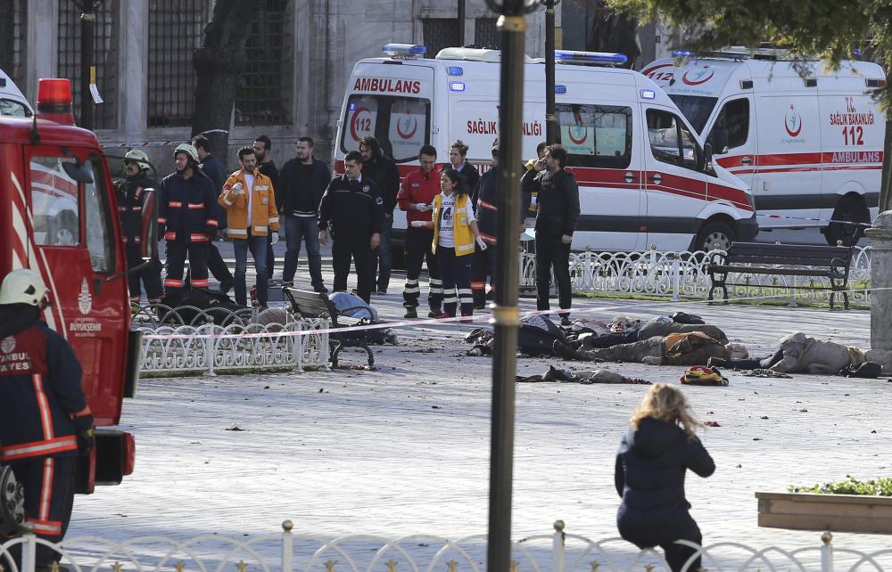 ATTENTION EDITORS - VISUALS COVERAGE OF SCENES OF DEATH OR INJURY Rescue teams gather at the scene after an explosion in central Istanbul, Turkey January 12, 2016. Turkish police sealed off a central Istanbul square in the historic Sultanahmet district on Tuesday after a large explosion, a Reuters witness said, and the Dogan news agency reported several people were injured in the blast. REUTERS/Kemal Aslan TPX IMAGES OF THE DAY TEMPLATE OUT.