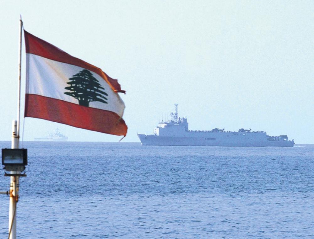 BEIRUT, LEBANON - JULY 21: (TURKEY OUT) A Lebanese flag waves as as American families are evacuated by a U.S. Marine helicopter ship in the Mediterranean Sea on July 21, 2006 in Beirut, Lebanon. Hezbollah fought fierce battles with Israeli troops on the Lebanese border on Thursday, as thousands more foreigners fled the ten-day-old war in Lebanon, including 1,000 Americans evacuated by U.S. Marines. (Photo by Burak Kara/Vatan Daily/Getty Images)