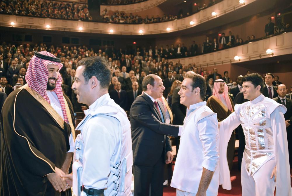 
A handout picture released by the Egyptian Presidency on Monday shows Egyptian President Abdel Fattah El-Sisi (3L)) and Crown Prince Muhammad Bin Salman, deputy premier and minister of defense, shaking hands with members of the cast after seeing an opera in Cairo. — AFP