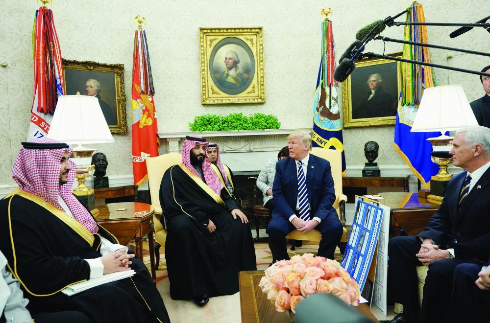 US President Donald Trump meets with Saudi Arabia's Crown Prince Mohammed bin Salman in the Oval Office of the White House on March 20, 2018 in Washington, DC. / AFP / MANDEL NGAN
