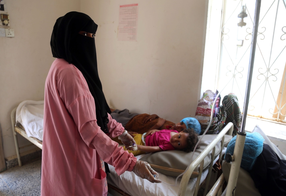 Yemeni children suspected of having been infected by cholera are treated at a hospital in the Yemeni coastal city of Hodeidah on May 26, 2018. More than 2,200 people have reportedly died of cholera over the past year in Yemen, with another one million suspected cases across the country. / AFP / ABDO HYDER
