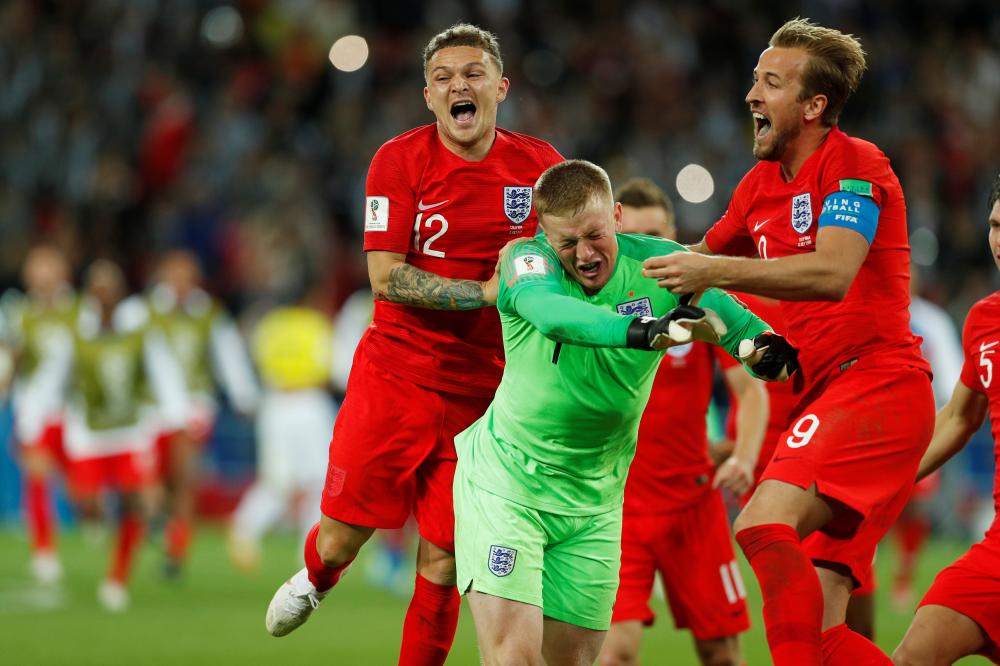 Soccer Football - World Cup - Round of 16 - Colombia vs England - Spartak Stadium, Moscow, Russia - July 3, 2018  England's Jordan Pickford celebrates with team mates after saving Colombia's Carlos Bacca penalty during the shootout   REUTERS/John Sibley