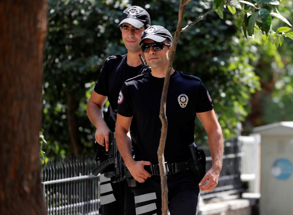 Police officers patrol outside the home of U.S. pastor Andrew Brunson in Izmir, Turkey August 20, 2018. REUTERS/Osman Orsal