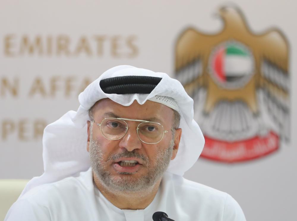 Emirati minister of state for foreign affairs, Anwar Gargash, speaks during a press conference in Dubai about the situation in Yemen on August 13, 2018. The United Arab Emirates, Riyadh's main partner in the Saudi-led military coalition battling Huthi rebels in Yemen, says it is also determined to wipe out Al-Qaeda in the country's south. / AFP / KARIM SAHIB
