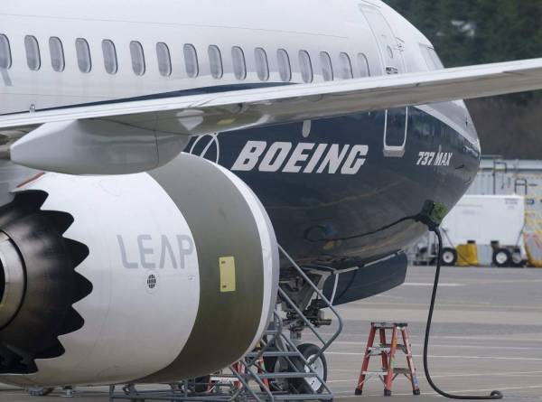 (FILES) In this file photo taken on March 22, 2019, a Boeing 737 MAX 9 test plane is pictured at Boeing Field in Seattle, Washington. Under growing scrutiny from investors and regulators, embattled US aerospace giant Boeing will have a chance this week to reset the narrative as it aims to pivot from two deadly crashes that have grounded a top-selling plane.The company will report earnings on April 24, 2019 for the first time since a deadly March 10 plane crash plunged the company into crisis-mode. / AFP / GETTY IMAGES NORTH AMERICA / STEPHEN BRASHEAR
