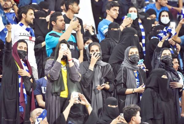 Women supporters of al-Hilal attend the AFC Champions League quarter-finals football match between Saudi Arabia's  Al-Ittihad and Al-Hilal at the King Saud University Stadium in Riyadh on September 17, 2019.  / AFP / Fayez Nureldine
