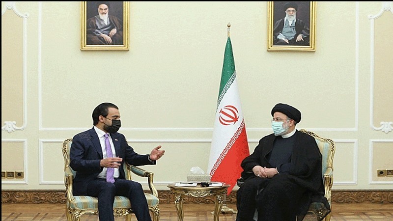 الحلبوسي في طهران مع الرئيس الإيراني.