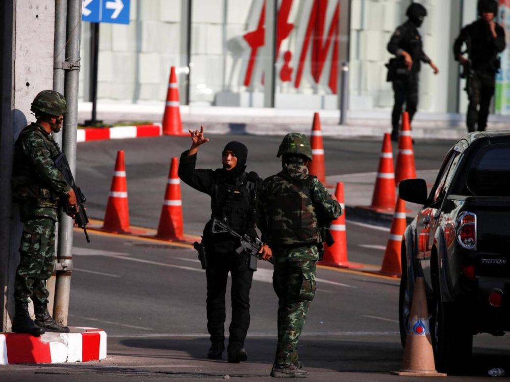 A soldier gestures as he shouts outside the Terminal 21 shopping mall following a gun battle involving a Thai soldier on a shooting rampage, in Nakhon Ratchasima, Thailand February 9, 2020. REUTERS/Soe Zeya Tun